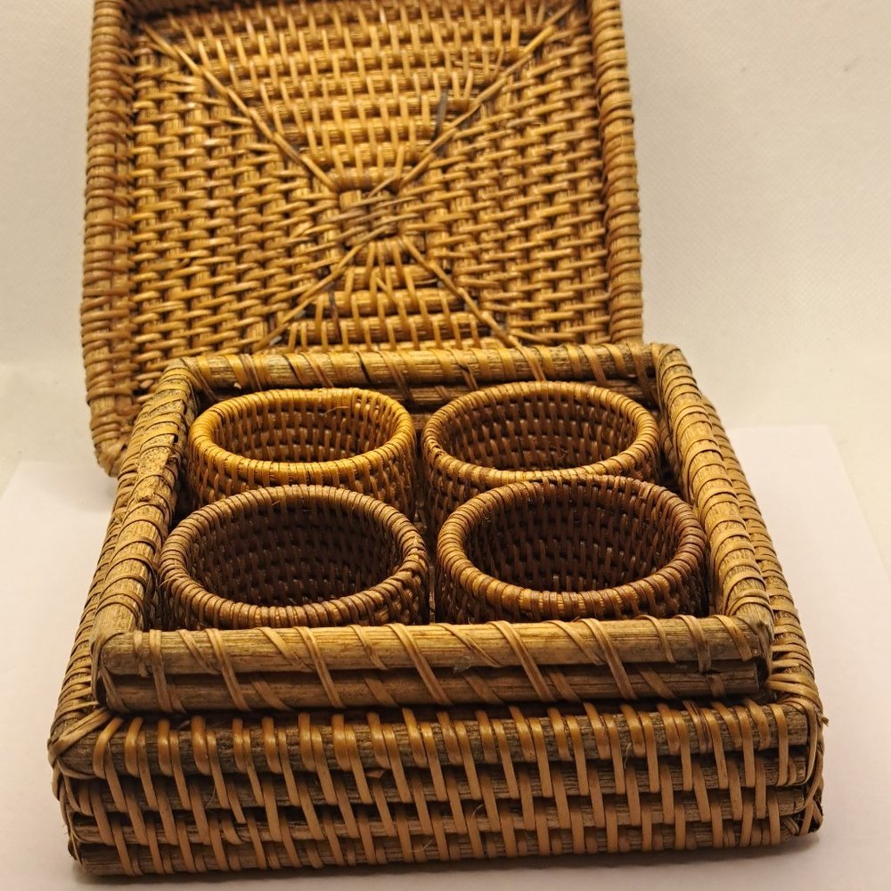 Fine rattan wicker napkin rings in a wicker lidded box.